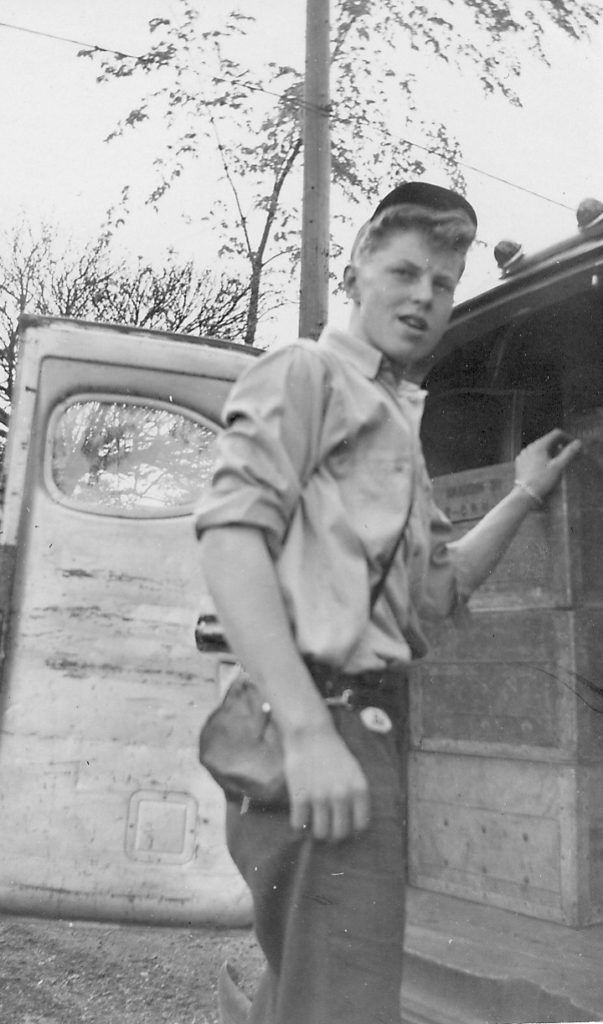 Young man delivering milk